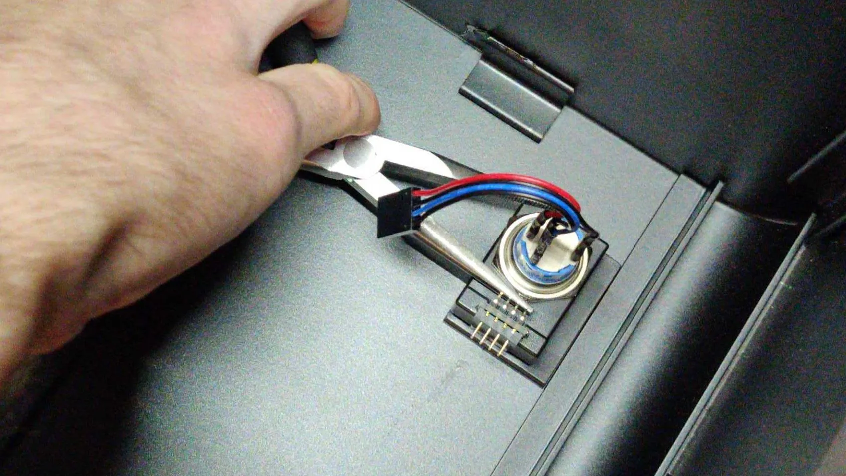 Screwing in the power button