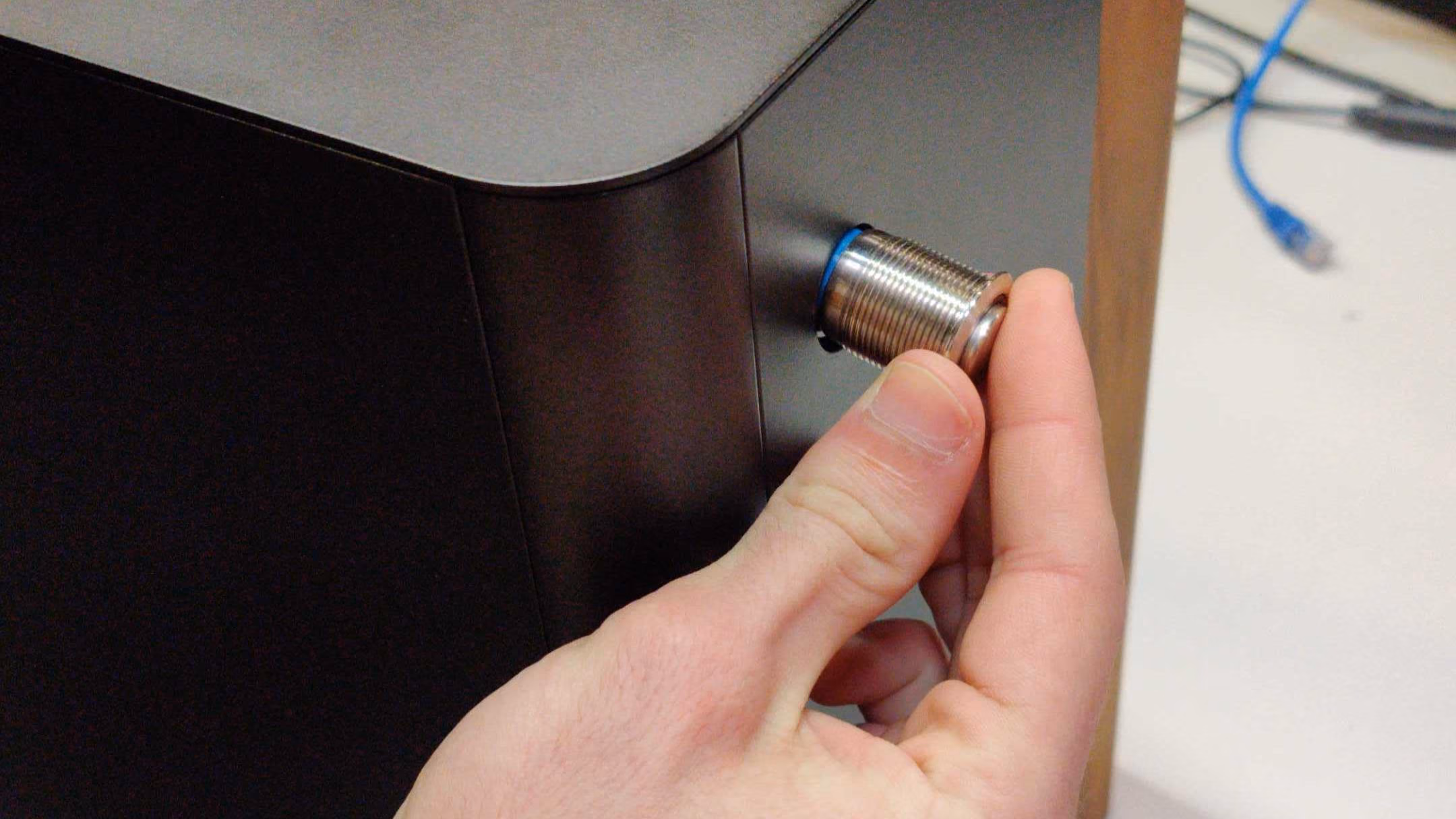 Inserting power button through top case