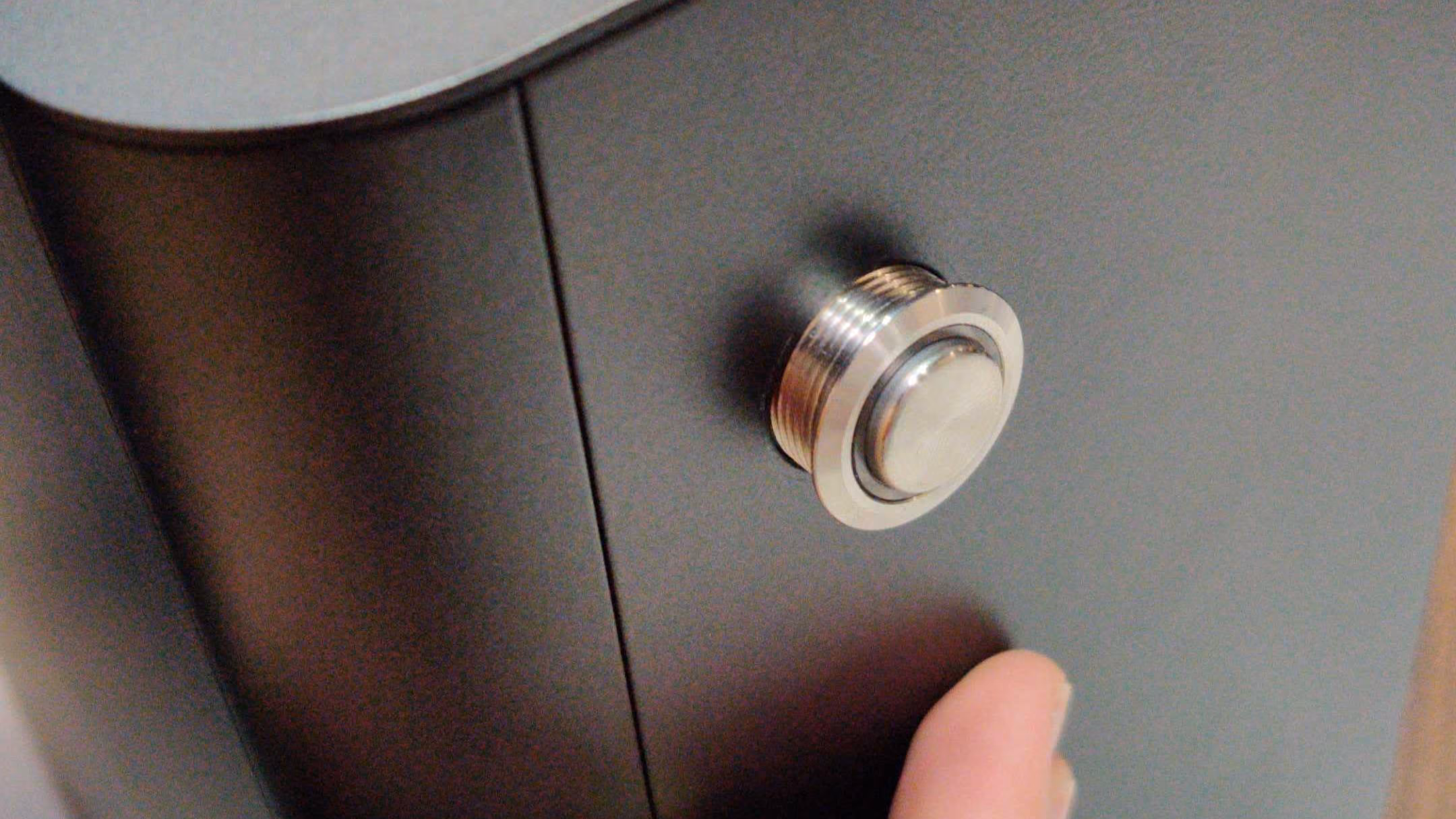 Removing button through hole in top-case