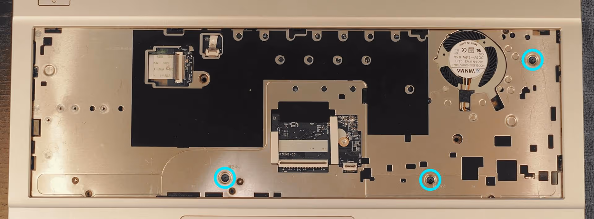 Under-keyboard screws